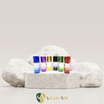 شیشه عطر استوانه رنگی ۲۰ میل کد AZY-16-5 برروی سنگ